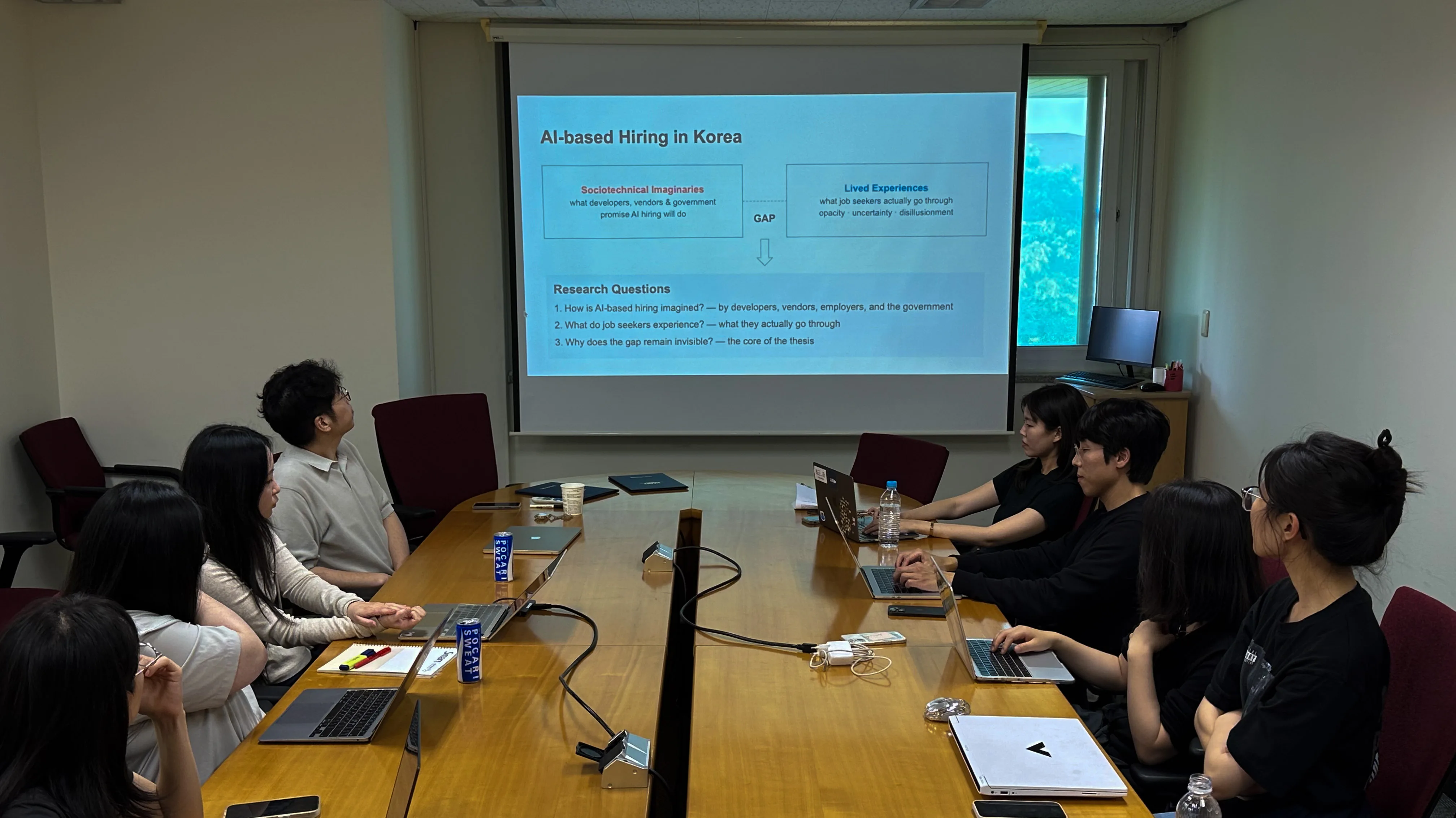 KAIST researchers and graduate students presenting collaborative research on AI-based hiring in Korea.